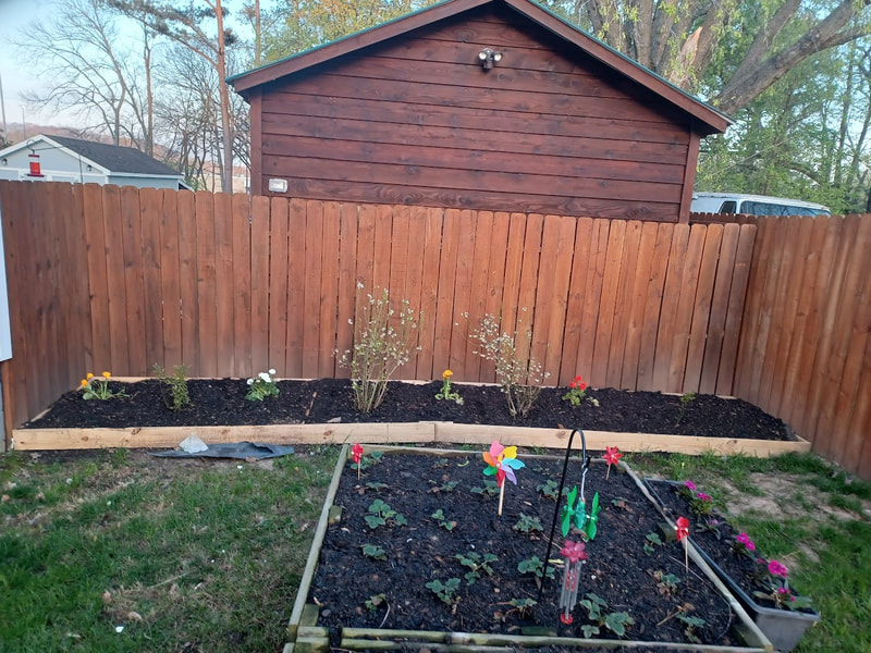 bed with weed barrier under landscape soil with dirt, mulch, sand and organic fertilizer.